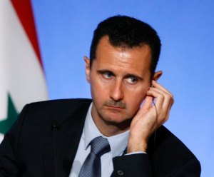 Syria's President Bashar al-Assad attends a news conference at the Elysee Palace in Paris